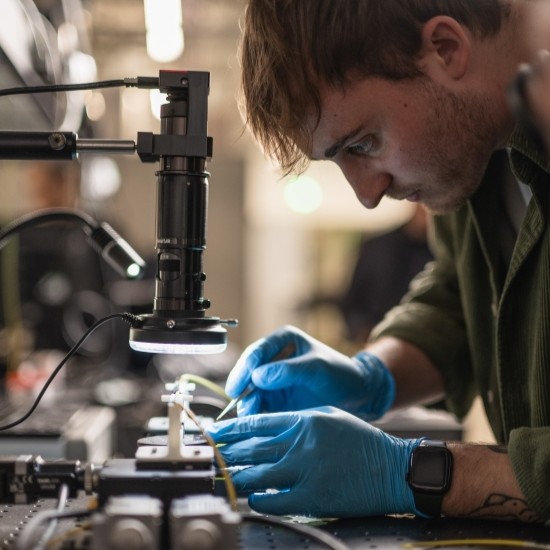 Researcher working in a laboratory environment.